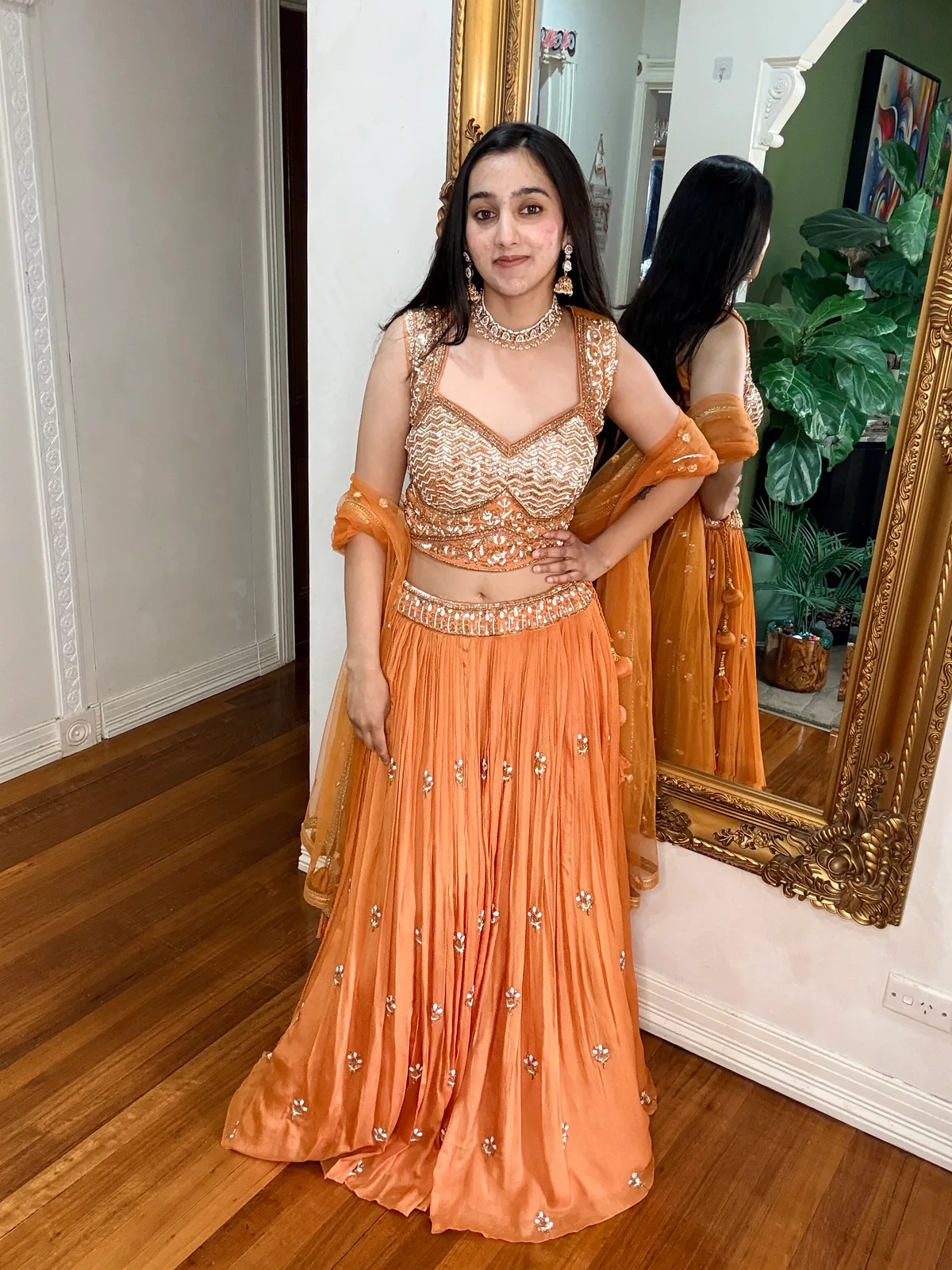Orange Lehenga Choli Set with Booti Embroidery — original photograph